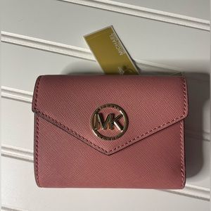 NWT Michael Kors leather wallet. Purchased @ Dillard brand new. Originally $128.